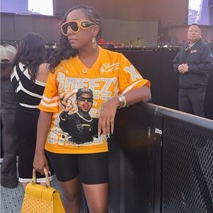 Orange Graphic T-Shirt with Black Shorts